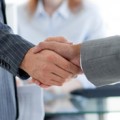 Close-up of businessmen shaking hands